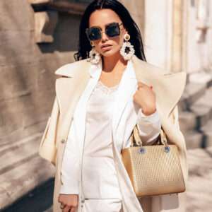 A classy woman holding designer bag